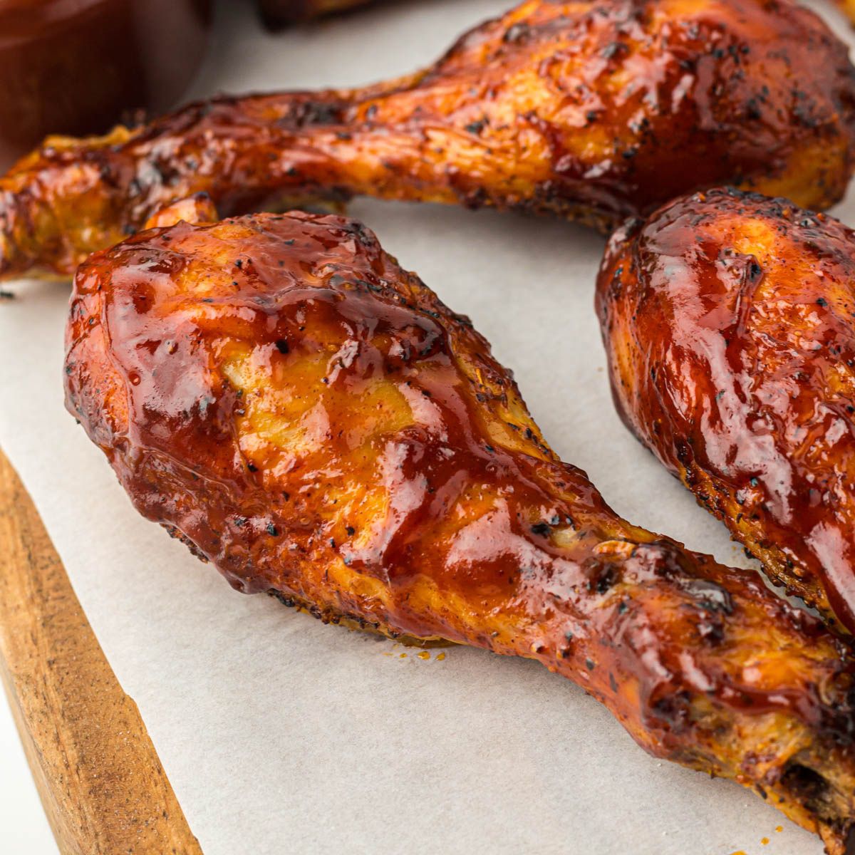 Barbecue Chicken Drumsticks on a parchment paper.