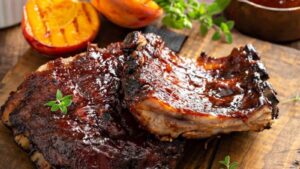 Easy Oven Baked Pork Ribs (Bourbon Peach BBQ Sauce)