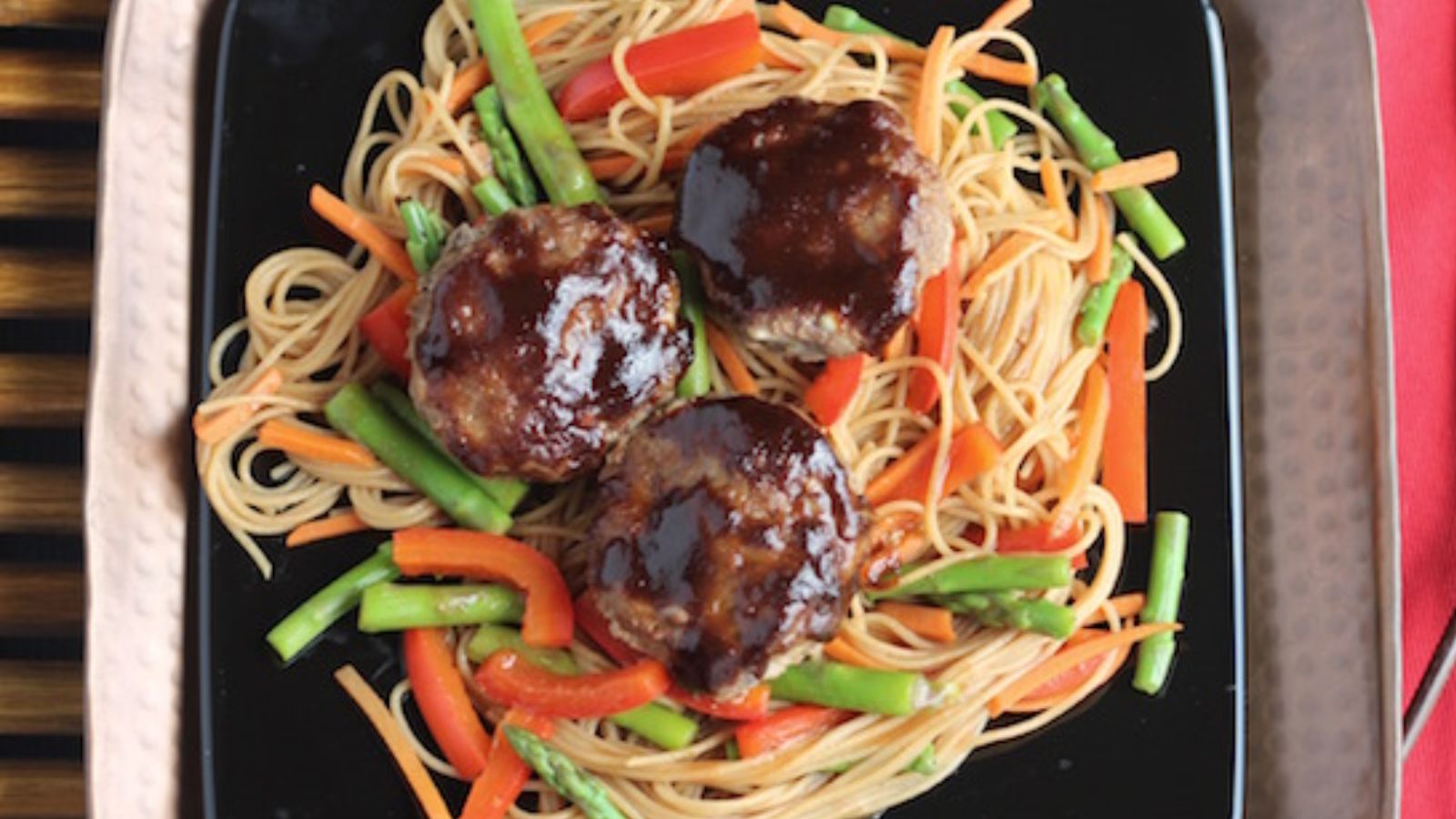 Hoisin-Glazed Mini Meatloaf “Muffins” Over Asian Noodles and Vegetables