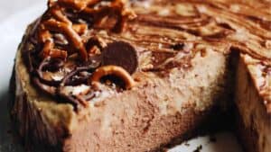Sweet and Salty Pretzel Peanut Butter Chocolate Cheesecake
